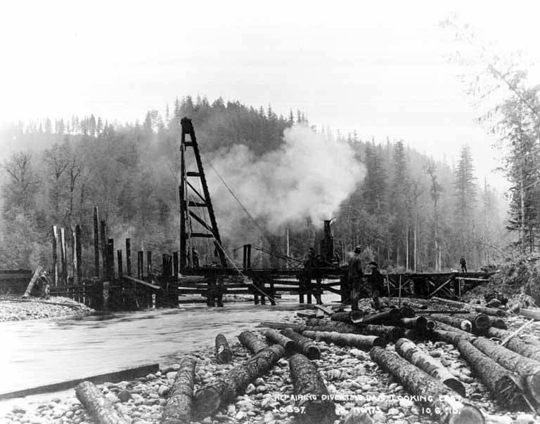 workers repairing an underground water pipe