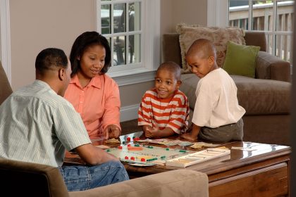 Family playing a board game together at home