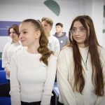 Students learning in a phone-free classroom, focused on their lesson